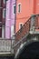 Brightly colored orange and pink houses in Burano where every house is painted in beautiful colors Burano Venice Italy