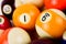 Brightly colored pool or billiard balls close up on white background