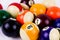 Brightly colored pool or billiard balls close up on white background