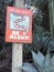 Brightly colored rattlesnake warning sign on a path in a desert park in Arizona