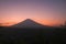 Brightly colored sky in red and orange, shortly after sunset. The sun set behind the Agung volcano on Bali Island.