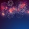 Brightly colorful fireworks with pale smoke