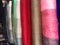 Brightly coloured clothes, ropes, rugs for sale at a market in ecuador