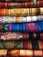 Brightly coloured clothes, ropes, rugs for sale at a market in ecuador