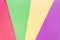 Brightly coloured striped background in pink, yellow, green and purple