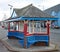 Brightly coloured wooden bus shelter on the seafront at Minehead in Somerset