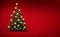 Brightly decorated Christmas tree isolated on red  background