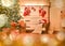 Brightly lit living room, festively decorated at Christmas.