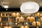 Brightly Lit Round Ceiling Lighting with Wood Partition in Blurry background