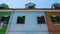 Brightly painted blue house in multicolored street, Burano island architecture