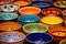 brightly painted ceramic bowls in an array