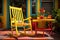 a brightly painted rocking chair on a patio with a glass of lemonade on the table next to it