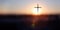 The brightly rising New Year\\\'s sunrise and the holy cross of Jesus Christ