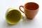 Brightly yellow and orange ceramic cups