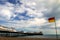 Brighton: beach surf rescue flag and pier