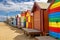 Brighton beach Victorain bathing boxes. Brightly painted colourful beach huts line the sand in Melbourne, Australia. They are