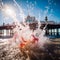 Brighton Pier has beautiful bright watercolors in the morning with splashing water to celebrate the New Year and Christmas