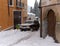Brihuega, Spain - January 9, 2021: A car stuck in the middle of a street in Brihuega (Spain) while a person tries to put