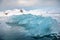 Brilliant blue iceberg floating in Antarctica waters