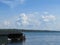 Brilliant blue sky, fluffy white clouds and a lake