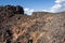 Brilliant colorful lava rocks along the Spatter Cones trail in Craters of the Moon National Monument in Idaho