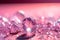 Brilliant diamonds on a pink background. Macro shot with shallow depth of field