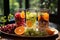 A brilliant display of summer-sweet citrus fruits, arranged on a crisp white table and gleaming glass drinkware