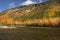 Brilliant fall foliage at Saco Lake in the White Mountains.