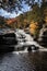 Brilliant fall foliage surrounds the beautiful cascading Shohola Falls in the Pennsylvania Poconos