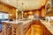 Brilliant kitchen with stained wood cabinets and hardwood floor.