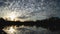 Brilliant Sunrise Clouds over Lake Timelapse Wide Shot