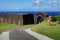 Brimstone Hill Fortress entrance gate and road with directions sign, St. Kitts Island