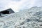 Brine salt farm warehouse with sky and clouds. Pile of organic sea salt. Raw material of salt industrial. Ocean salt. Sodium