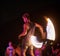 Bringing fire and entertainment to the night. Shot of a fire performance on a beach in Thailand.