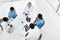 Bringing their expertise together. High angle shot of a group of medical practitioners having a meeting in a hospital