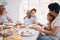 Bringing together the people I love most. a family having lunch together.