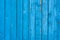 Bringt blue old painted vertical wooden planks. Abstract vintage wood background texture