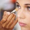 Brining out the best for that special occasion. A young woman having makeup applied.