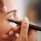 Brining out the best for that special occasion. A young woman having makeup applied.