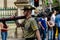BRISBANE, AUSTRALIA - APR 25 2014: A soldier carrying survey equipment marches  past crowds in Brisbane`s annual Anzac Day Parade