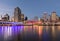 Brisbane skyline with Victoria Bridge over Brisbane River at night time