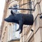 Bristol, UK - February 12 2020: Unusual half pig sign hangs outside Pata Negra wine and tapas restaurant on Clare Street
