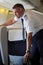 British Airways Middle Aged Male Captain Pilot in an Airplane cabin