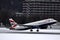 British Airways plane landing on snow, winter in Innsbruck Airport INN