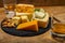 British drinks and food, glasses of Scotch whisky and cheeses collection, blue Stilton, Scottish coloured and English matured