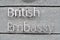 British embassy sign on grey wall