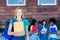 British female student with red hair and group of students