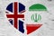 British and Iran flags in a broken heart