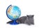 British kitten lying next to the globe. isolated on white background