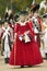 British lady in red dress watches with disdain the British surrender to General George Washington at the 225th Anniversary of the